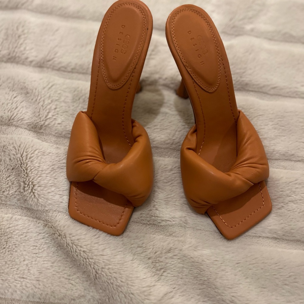 ASOS DESIGN Niki padded twist high heeled mules in orange